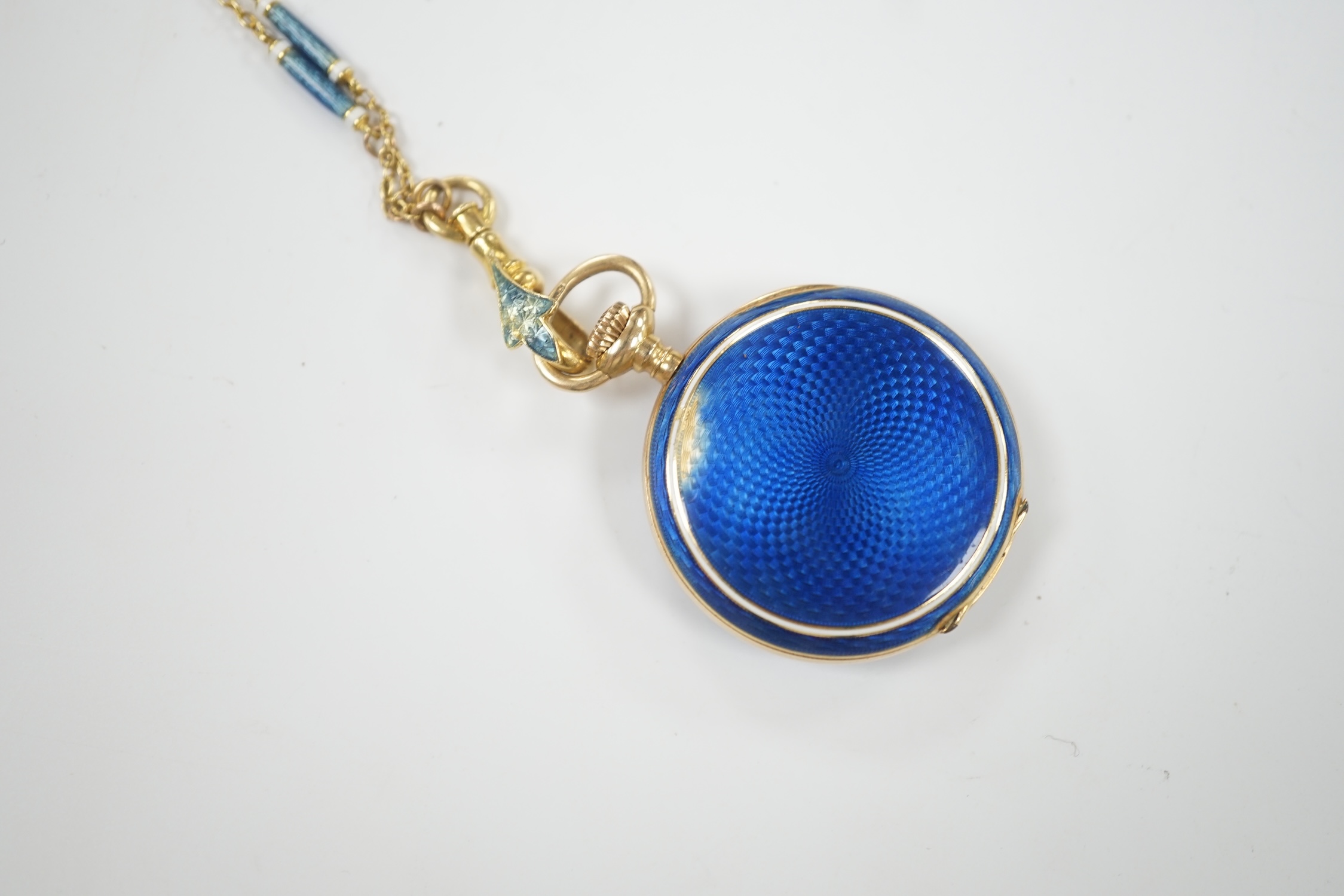 An early 20th century continental 15ct gold and enamel open face fob watch, on an 18ct and two colour enamel chain, 64cm, gross weight 26.5 grams (enamel a.f.).